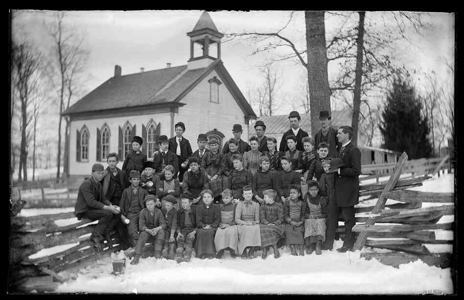 School portrait outside schoolhouse, possibly Mount Pleasant, Ohio, early 20th century, Walter J. Hussey
