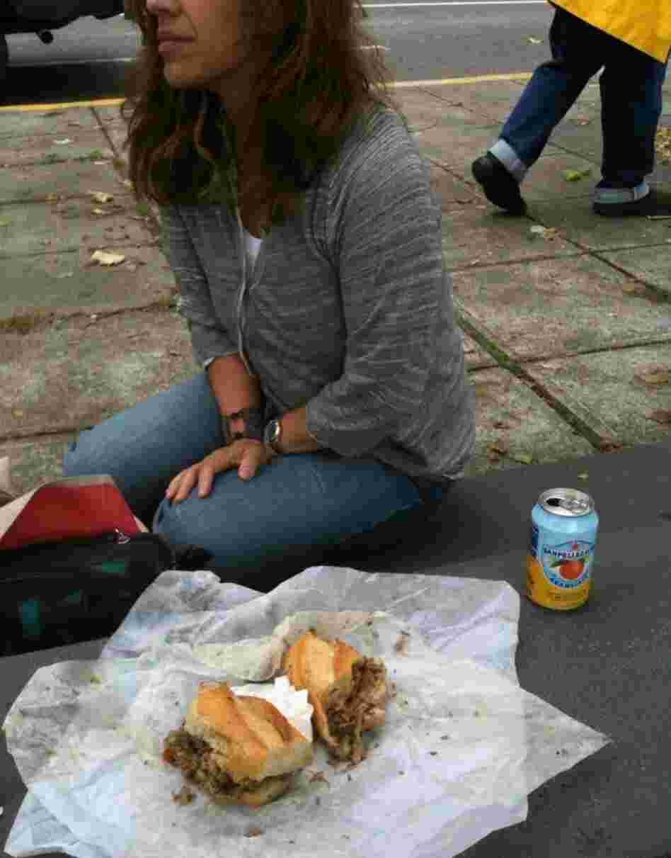 Rita stops eating her sandwich. Rita stops eating her sandwich.