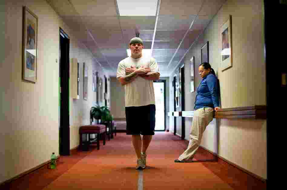 Brandon Sanford performs balance exercises with physical therapist Tess Tiscareno. Originally diagnosed with PTSD by the neurologist at Ft. Bliss, he now recieves specialized care for a brain injury at Mentis.