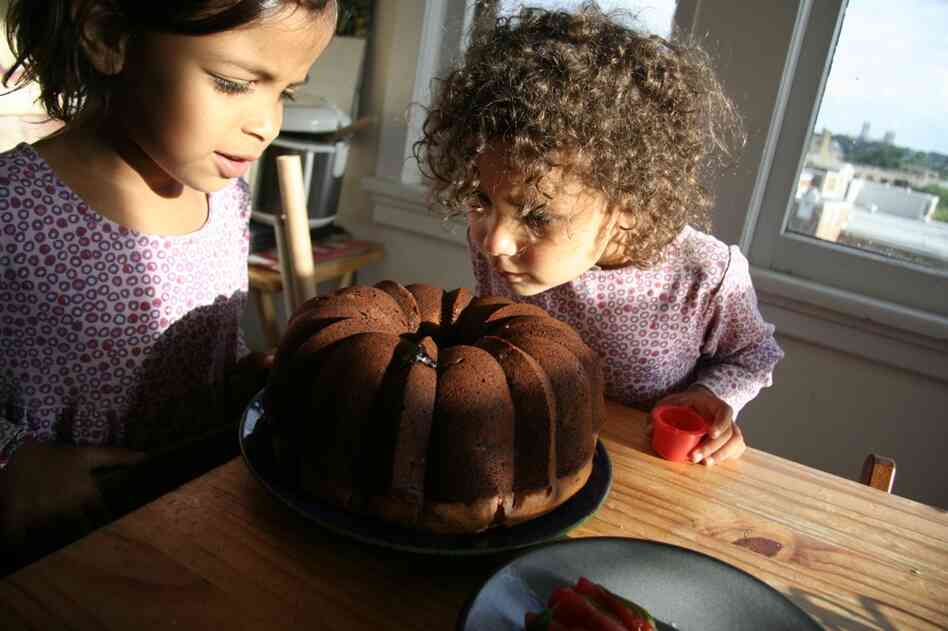 They give the blackberry cake, fresh out of the oven, a good sniff.
