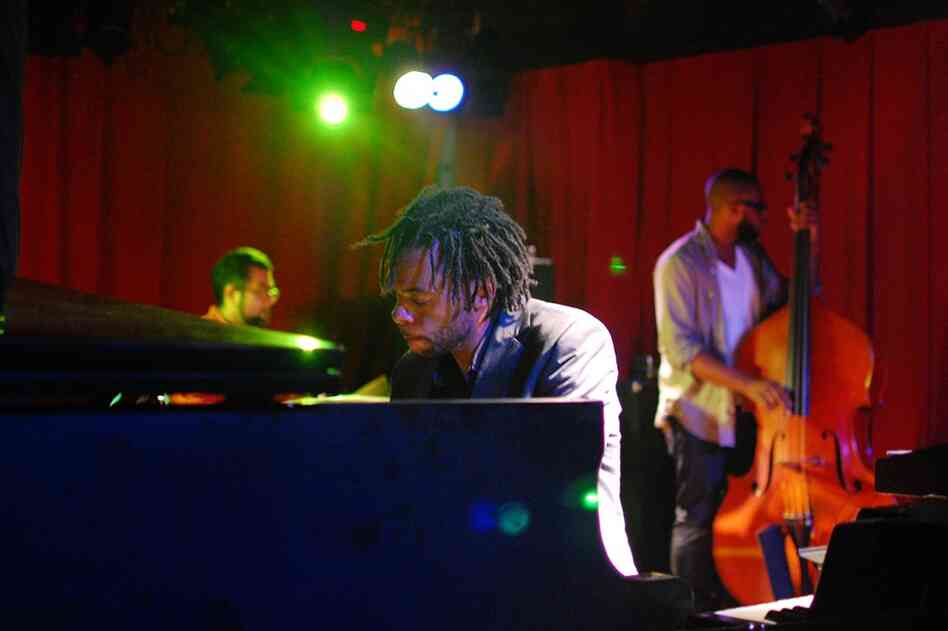 The New York version of the Marc Cary Focus Trio, performing at Sullivan Hall. Cary (piano) is joined by Burniss Earl Travis on bass and Sameer Gupta on drums.