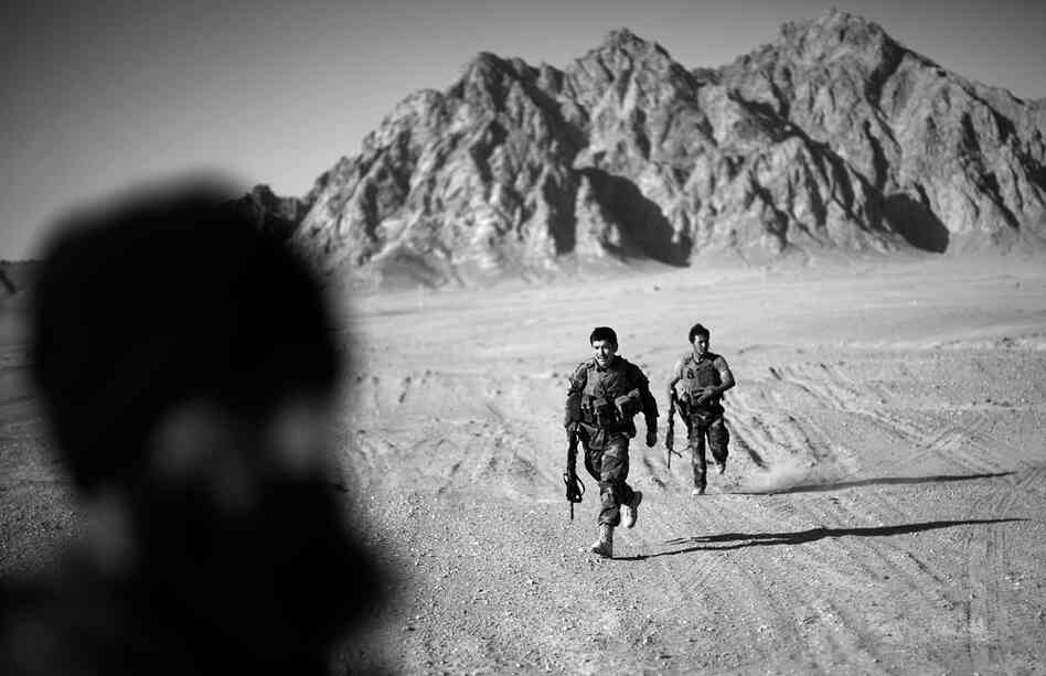 Two members of the Afghan army's first-ever special operations team in southern Afghanistan. The team was deployed in the field just weeks ago and has been joined by teams of U.S. Army Special Forces in a collaborative security effort outside of Kandahar city.