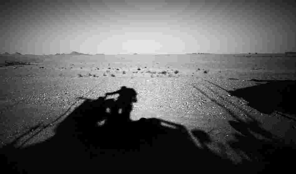 A U.S. armored vehicle makes its way through the desert outside Ezabad. While the U.S. Army Special Forces mentor their Afghan counterparts in counterinsurgency tactics, they also benefit from the Afghans' knowledge of local culture and customs.