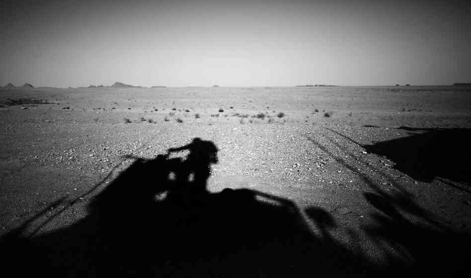 A U.S. armored vehicle makes its way through the desert outside Ezabad. While the U.S. Army Special Forces mentor their Afghan counterparts in counterinsurgency tactics, they also benefit from the Afghans' knowledge of local culture and customs.
