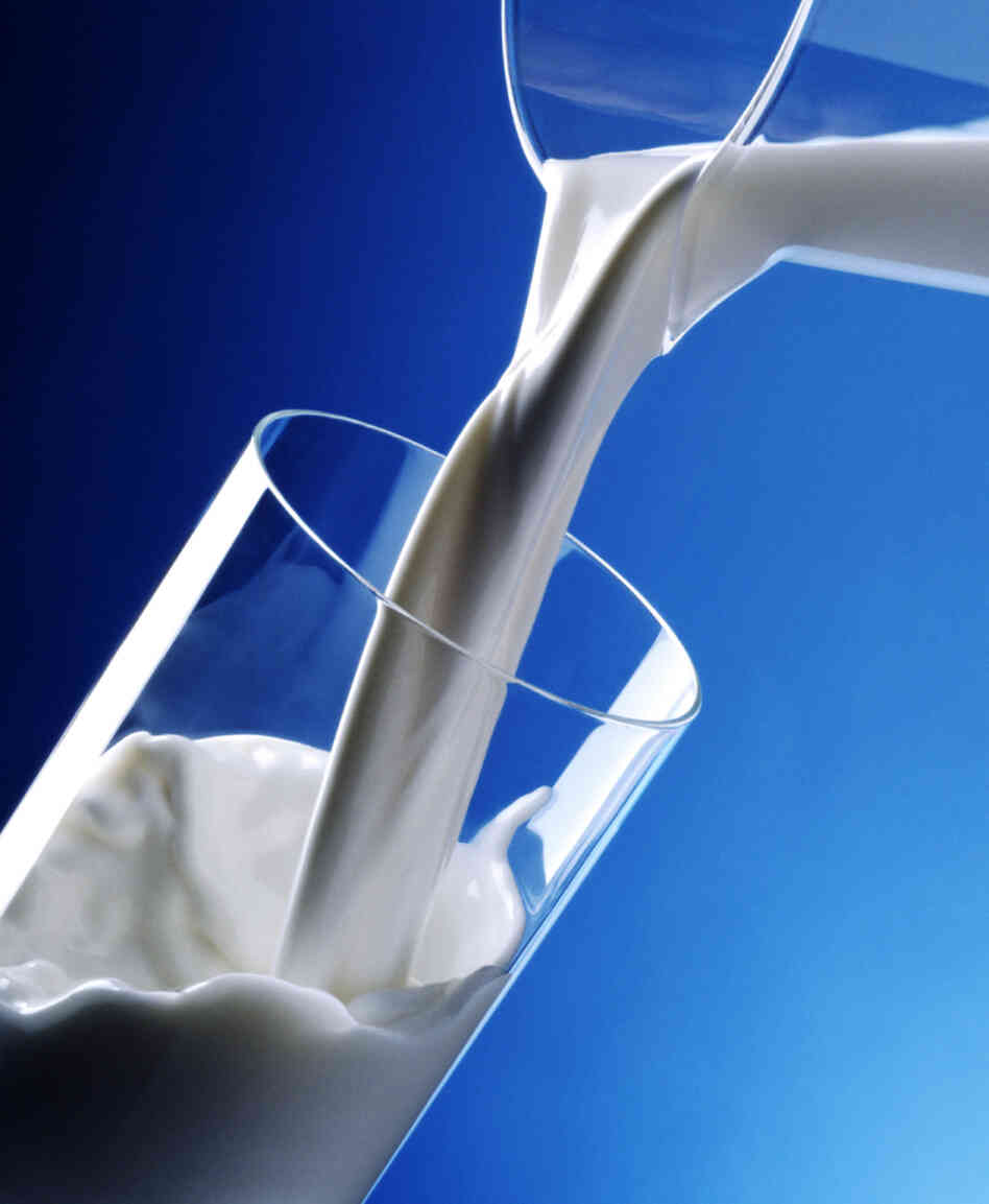 milk pouring into glass milk pouring into glass
