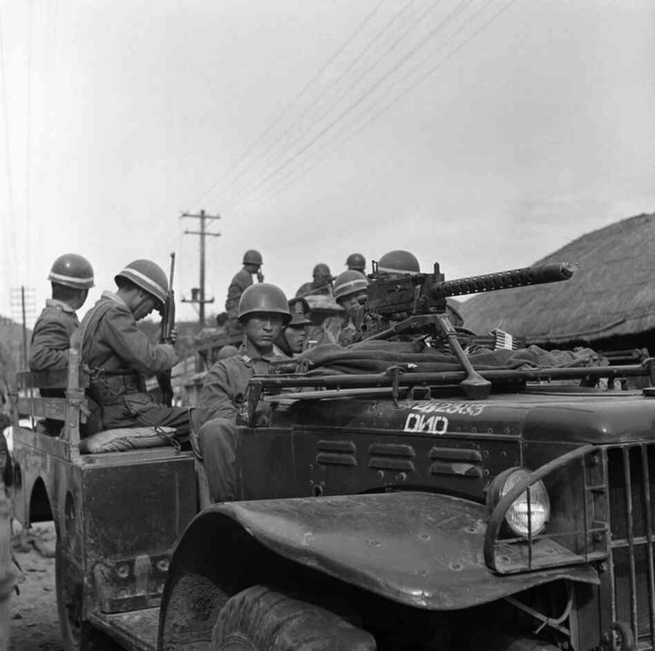 South Korean army troops mount American-supplied military vehicles on June 25, 1950, in response to the invasion of North Korean troops. 