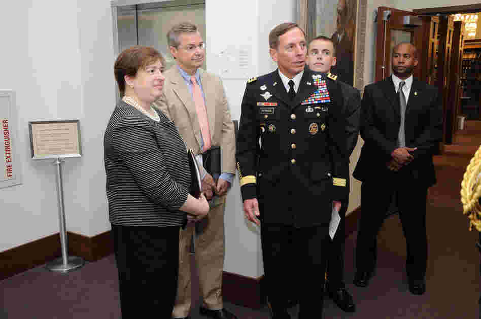 Kagan and Gen. David Petraeus (center) participate in a pinning ceremony June 3, 2009, for Harvard Law School student Kyle Scherer. Opposition to Kagan has focused partly on her stance on the military; at Harvard, she opposed letting military recruiters on campus because of the "don't ask, don't tell" policy. 