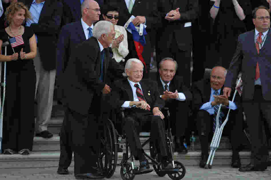 Byrd, seated in a wheelchair, awaits the hearse carrying the remains of Sen. Edward Kennedy in August 2009 in Washington. Byrd and Kennedy served together in the Senate for nearly 50 years.  