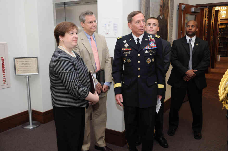 Kagan and Gen. David Petraeus (center) participate in a pinning ceremony June 3, 2009, for Harvard Law School student Kyle Scherer. Opposition to Kagan has focused partly on her stance on the military; at Harvard, she opposed letting military recruiters on campus because of the "don't ask, don't tell" policy. 