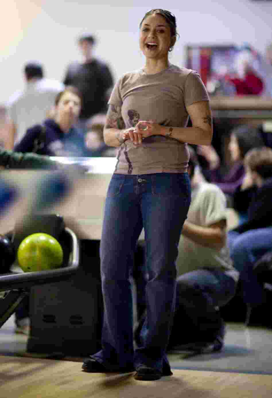 Colleen Segbers cheers for her daughter, Gwenyth Pettitt, 5, while she bowls. Segbers wasn't married when she got pregnant, although she did later marry Gwyneth's father. She loves her husband, she says, but that is not why they decided to get married – they did it because she needed health insurance.