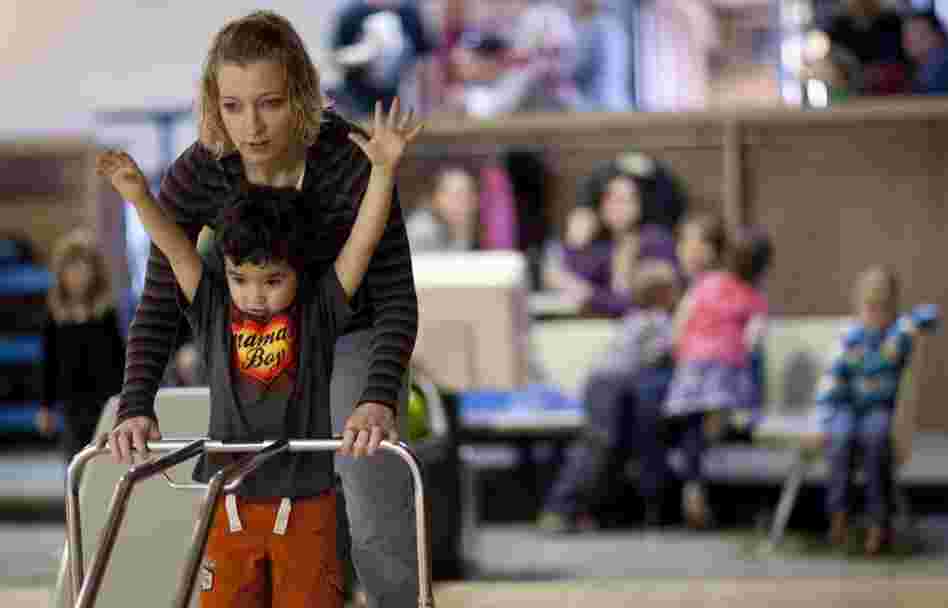 Many of Zimmerman and Garland's friends also chose to have children before marriage. Here, Lexi Camburn helps her son, Zane, bowl during the party. Camburn says she never considered marrying Zane's father, although she does hope to get married someday. She says she's waiting for "everything to be right."
