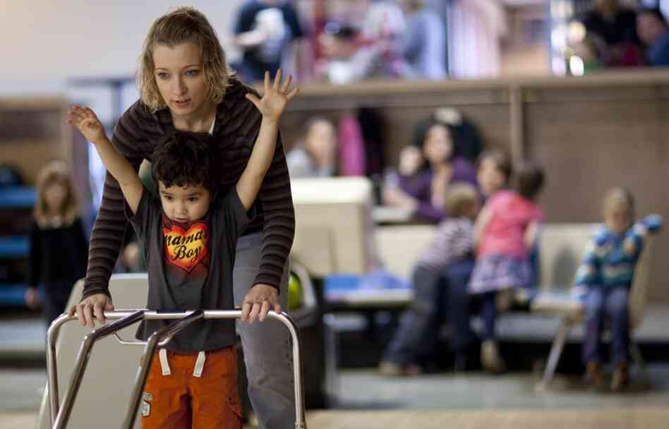 Many of Zimmerman and Garland's friends also chose to have children before marriage. Here, Lexi Camburn helps her son, Zane, bowl during the party. Camburn says she never considered marrying Zane's father, although she does hope to get married someday. She says she's waiting for "everything to be right."