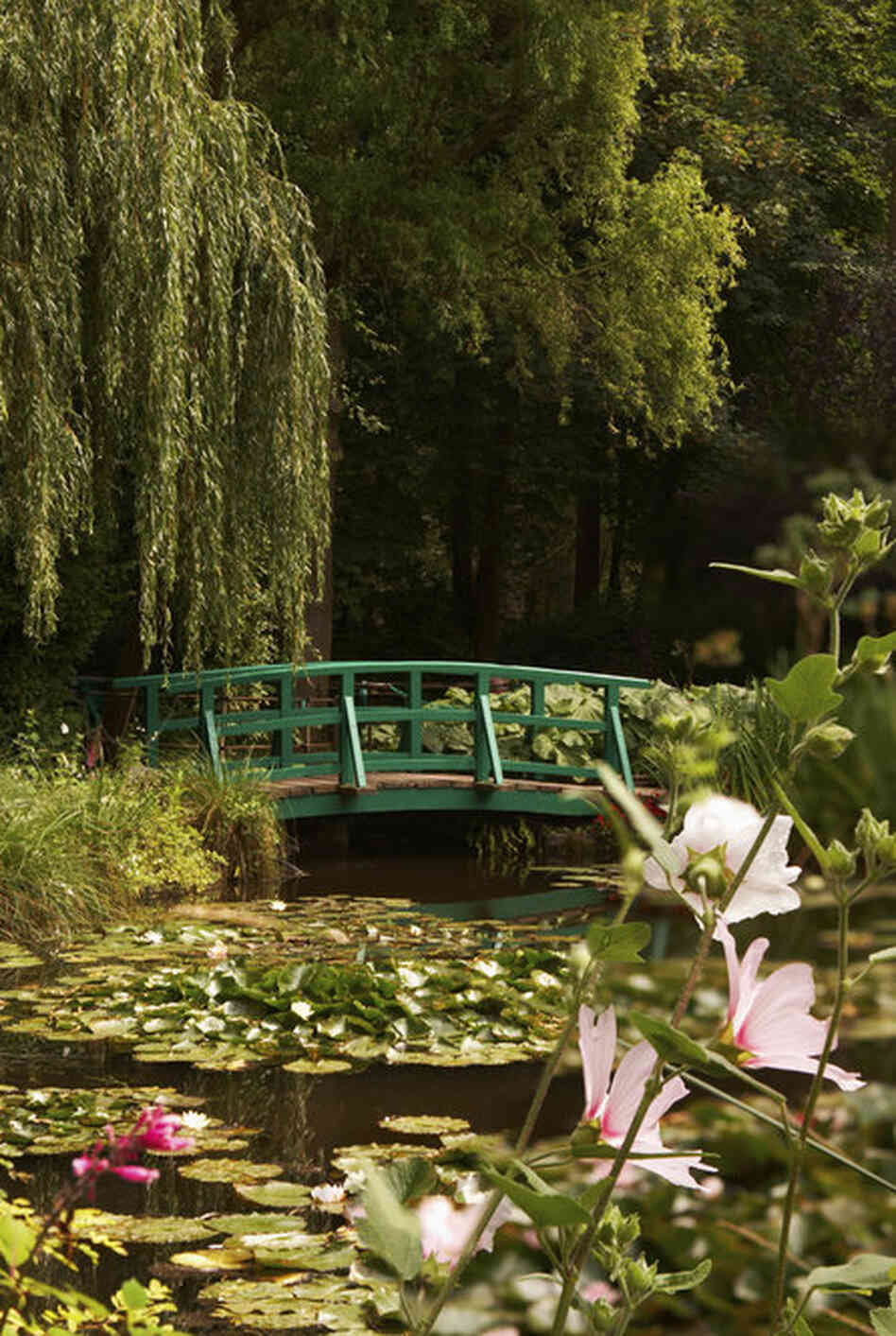 Another view of of Monet's garden as it is today. Monet modeled this part of the gardens, surrounding his house, on Japanese gardens. The artist was an avid collector of Japanese prints, which influenced Impressionism as a whole. 