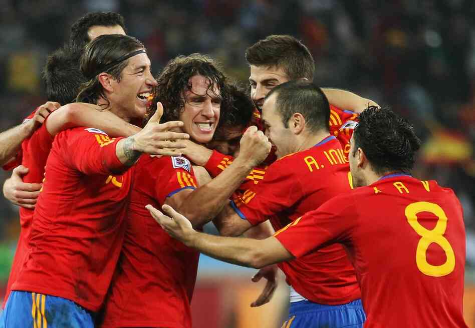 Members of the team from Spain celebrate the opening goal scored by Carles Puyol. Spain beat Germany 1-0. 