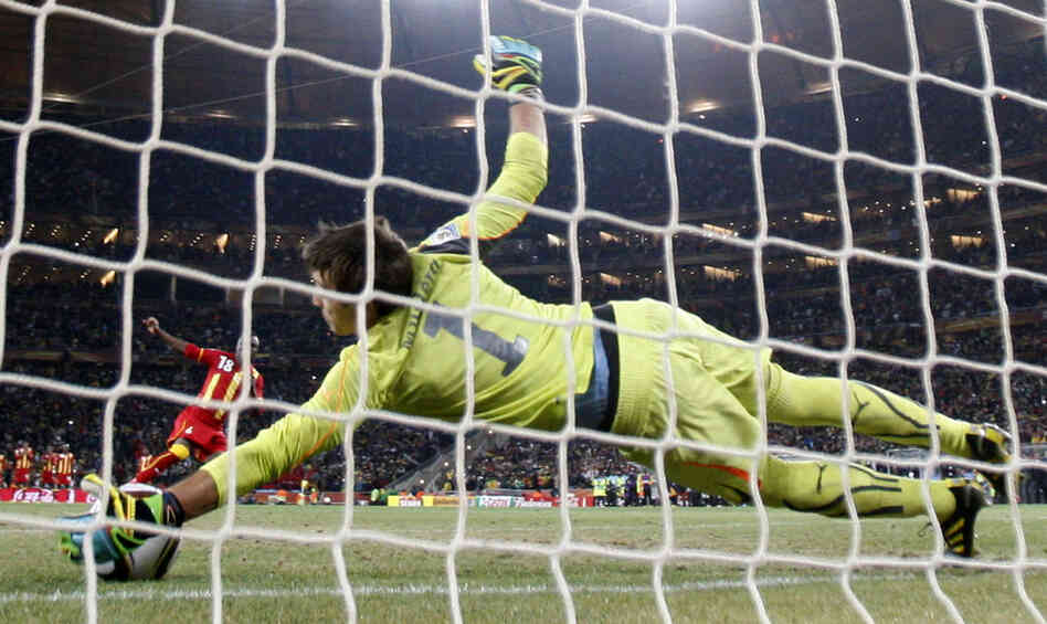 Ghana's Dominic Adiyiah fails to score on a shootout against Uruguay goalkeeper Fernando Muslera. 