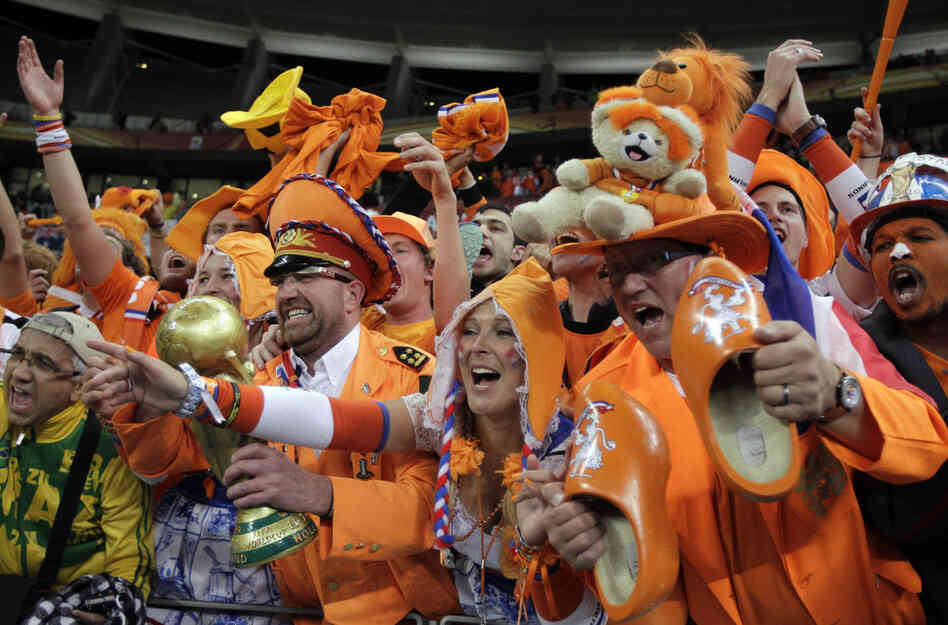 Netherlands supporters celebrate their team's 3-2 win over Uruguay to advance to the finals. 