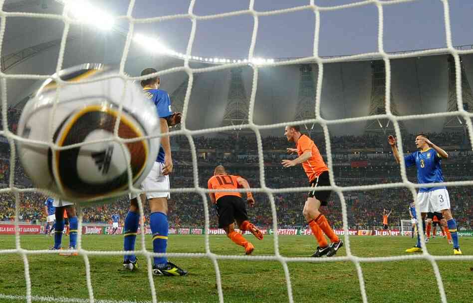 Midfielder Wesley Sneijder (center) scores the Netherlands' second goal during the 2010 World Cup quarterfinal match between the Netherlands and Brazil. 