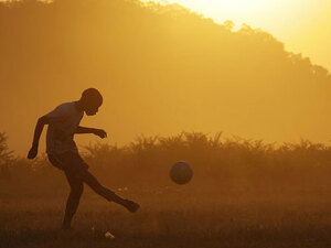 Kids play soccer outside Rustenburg, South Africa Kids play soccer outside Rustenburg, South Africa