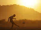 Kids play soccer outside Rustenburg, South Africa