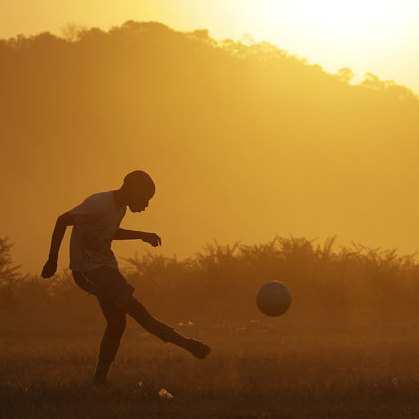 Kids play soccer outside Rustenburg, South Africa