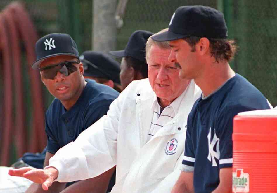 Steinbrenner talks with Don Mattingly (right) as outfielder Bernie Williams looks on during spring training in 1995. 