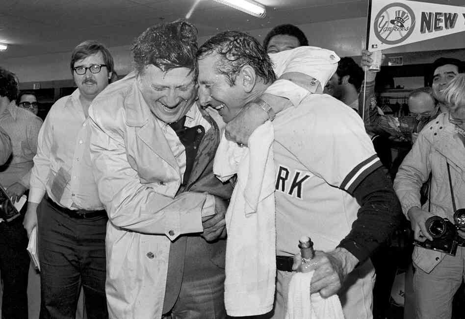 Steinbrenner (left) gives manager Billy Martin a hug after the Yankees won the American League Championship in 1977. 