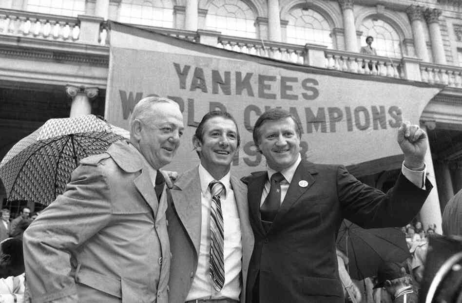 Yankees President Gabe Paul (from left), manager Billy Martin and owner George Steinbrenner celebrate the Yankees' world Series win in 1977. 