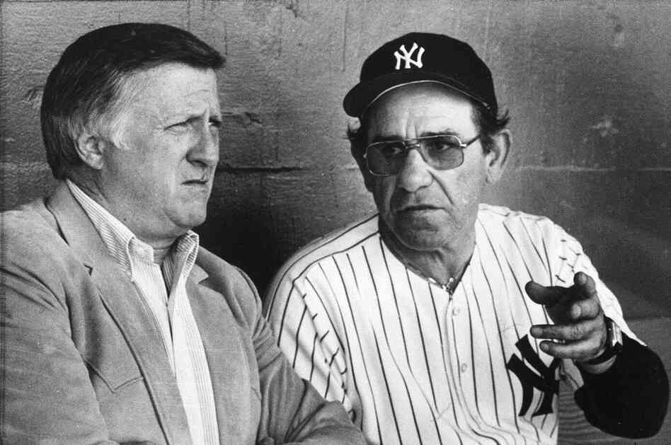 Yankees manager Yogi Berra talks with Steinbrenner in 1984. The two had a notoriously tumultuous relationship.  