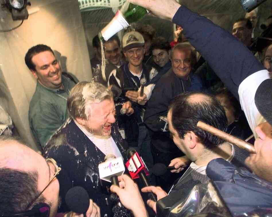 Steinbrenner is doused with champagne by shortstop Derek Jeter after the Yankees won the American League Championship in 1998. "Winning is the most important thing in my life after breathing," Steinbrenner often said. "Breathing first, winning next." 