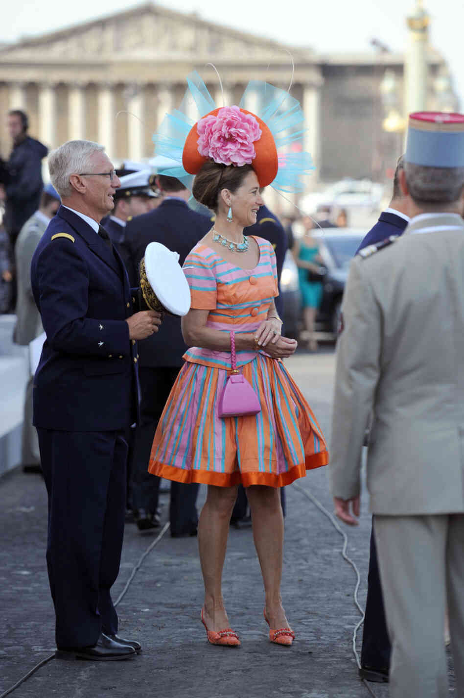 An unidentified woman arrives to attend the annual Bastille Day military parade in Paris. An unidentified woman arrives to attend the annual Bastille Day military parade in Paris.