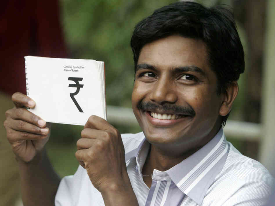 Indian scholar D.Udaya Kumar poses holdi Indian scholar D.Udaya Kumar poses holdi