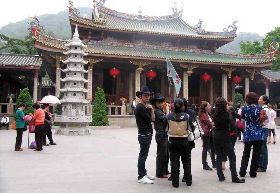 Crowds of tourists visit the ancient Nanputuo Temple in Xiamen, China. Chinese government support for Buddhism is increasing, possibly as a counterweight to the explosion of Christianity. Additionally, local governments get a share of the temple entrance fees. 