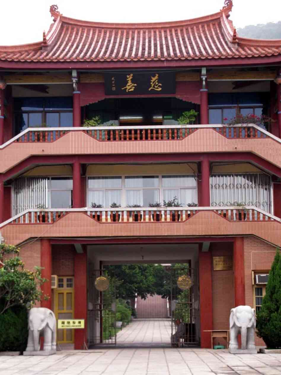 Chinese characters on the Nanputuo Temple's religious philanthropic foundation building read "Charity." The foundation is now one of the most developed religious funds in China. It has 45,000 members and publishes a newspaper and a magazine.