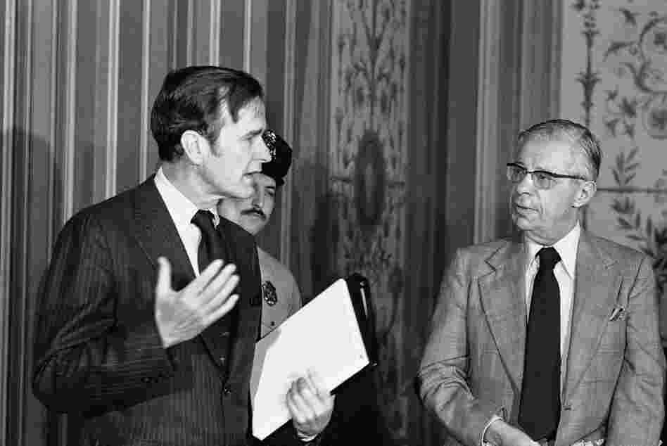 CIA Director George Bush (left) exchanges words with Schorr on Feb. 18, 1976, prior to giving a closed-door briefing to members of the Senate Foreign Relations Committee. 