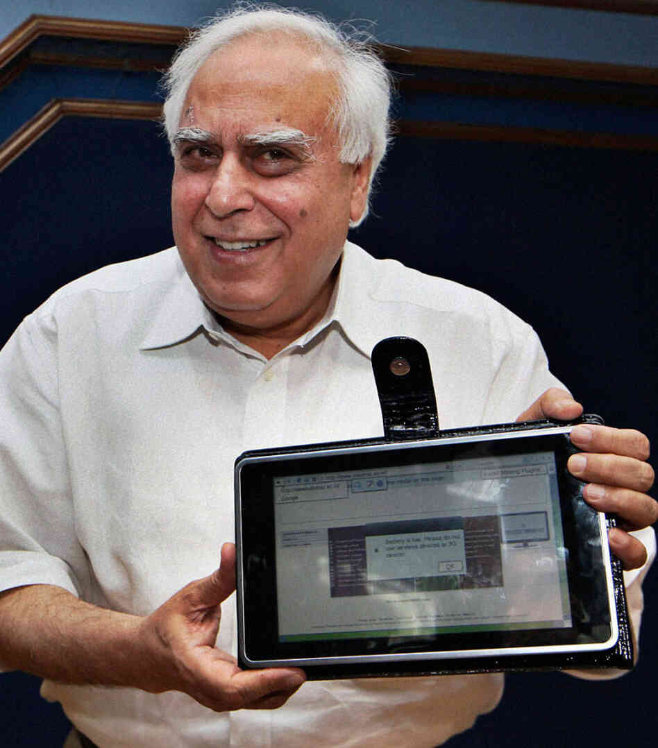 Kapil Sibal, India's human resource development minister, displays India's low-cost tablet prototype Kapil Sibal, India's human resource development minister, displays India's low-cost tablet prototype