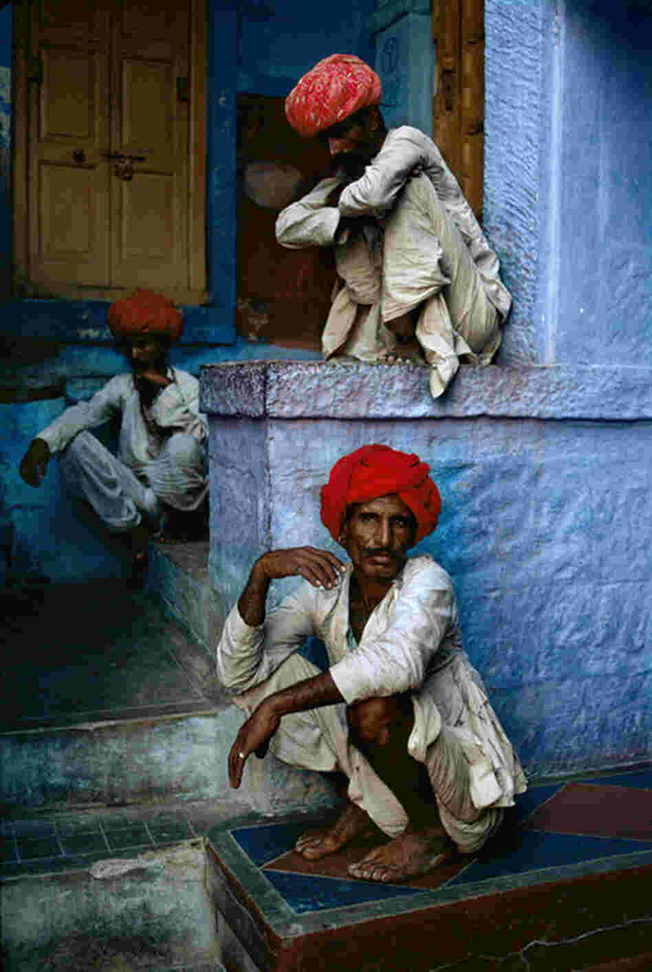 Three men sit in the old quarter in Jodhpur, India, 1996