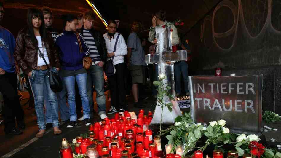 Mourners at the Love Parade site in Duisburg, Germany Mourners at the Love Parade site in Duisburg, Germany