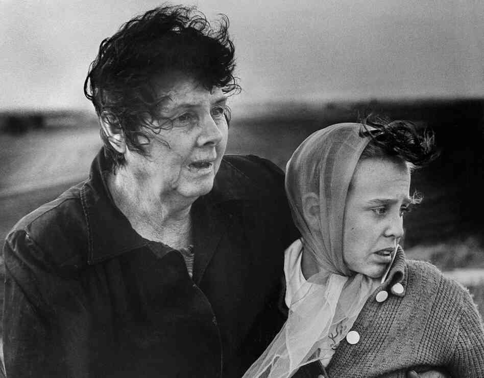 A mother and daughter survey the wreckage of their home after the historic June 8, 1966, tornado. 