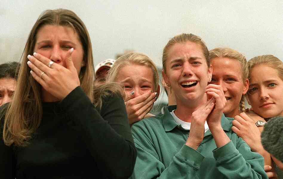Columbine High School students react to the news that some of their friends had survived the shooting carnage that claimed 15 lives near Littleton, Colo., on April 20, 1999. 