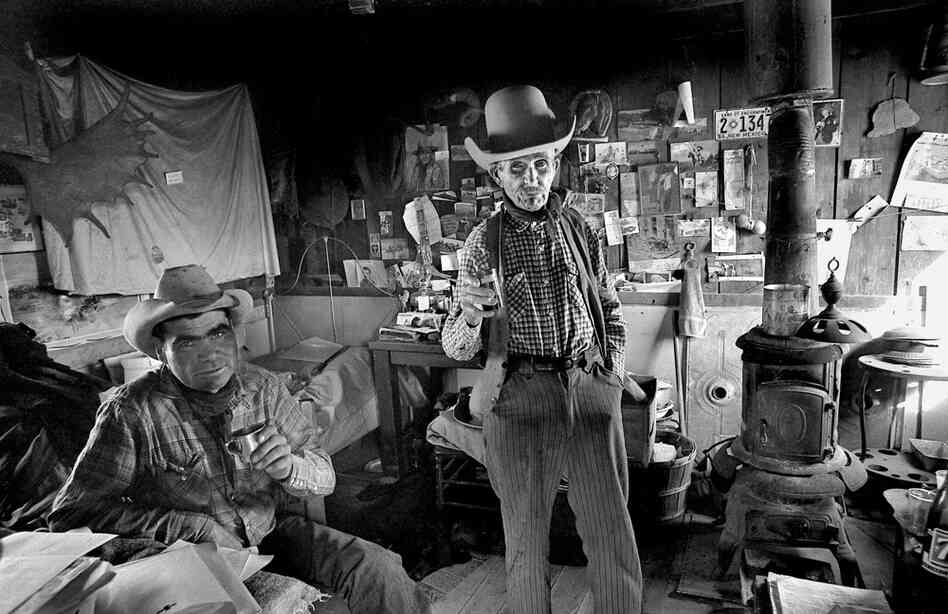 Bob Brislawn enjoys a shot of whiskey before going out on the range to check on some of Wyoming's wild mustangs. 