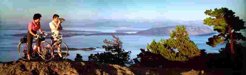 Mountain bikers, Olympic National Park and Strait of San Juan de Fuca, Washington. Displayed 1964 