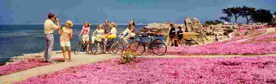 Teenagers on bikes at beach, Monterey Peninsula, California. Displayed 1968 