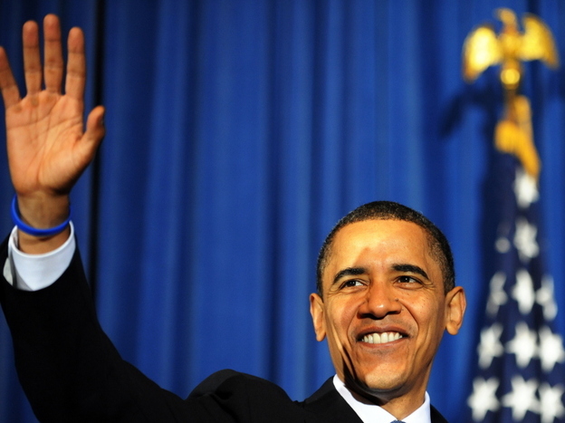 US President Barack Obama waves at the a