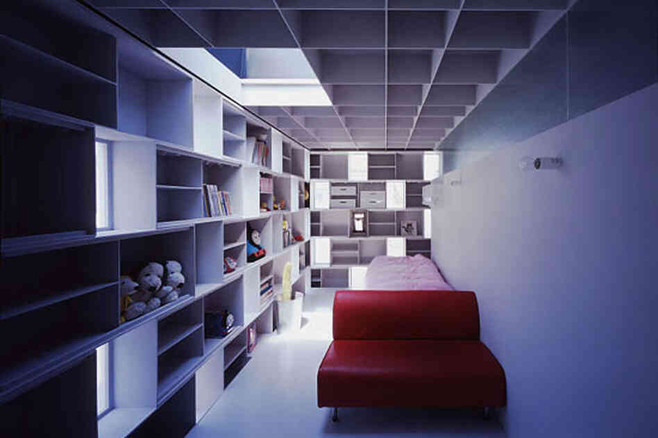 Built-in steel boxes are whimsical yet practical answer to limited space in the "Cell Brick" home, providing storage and, in the architect's words, "eliminating monotony".