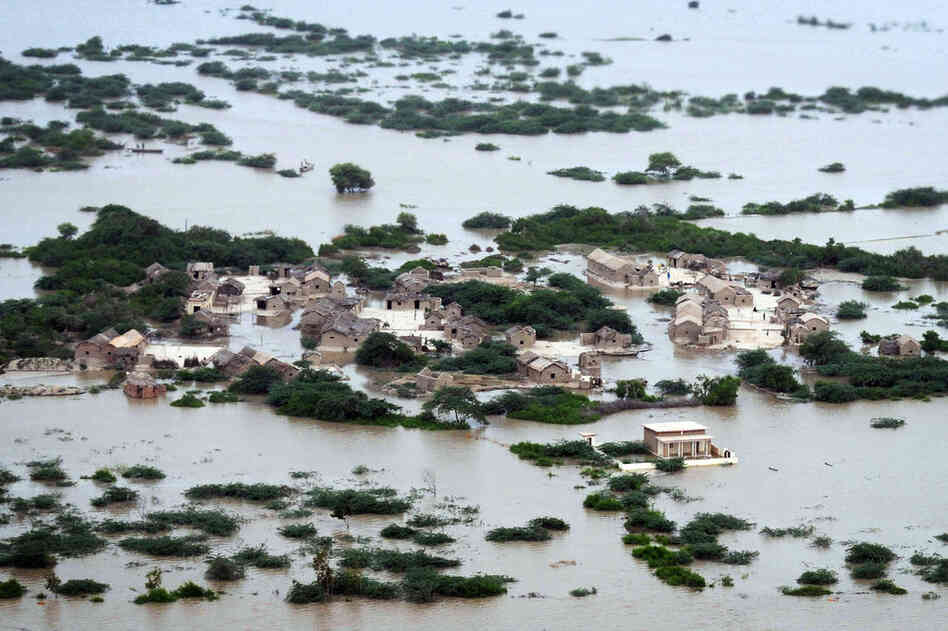 An aerial view shows the flooded Kharo Chan village in Pakistan's Sindh province on Aug. 25. The United Nations has described the widespread flooding in Pakistan as unprecedented, with more than one-third of the nation underwater. Officials say as many as 20 million people have been affected during Pakistan's worst flooding in 80 years. 