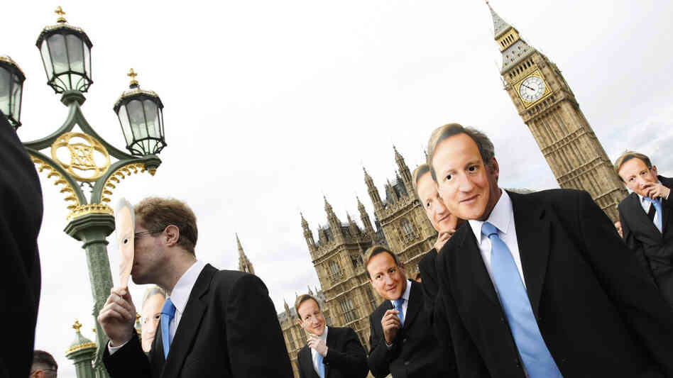 Men wearing face masks of British Prime Minister David Cameron demonstrate in London for a ban on th Men wearing face masks of British Prime Minister David Cameron demonstrate in London for a ban on th