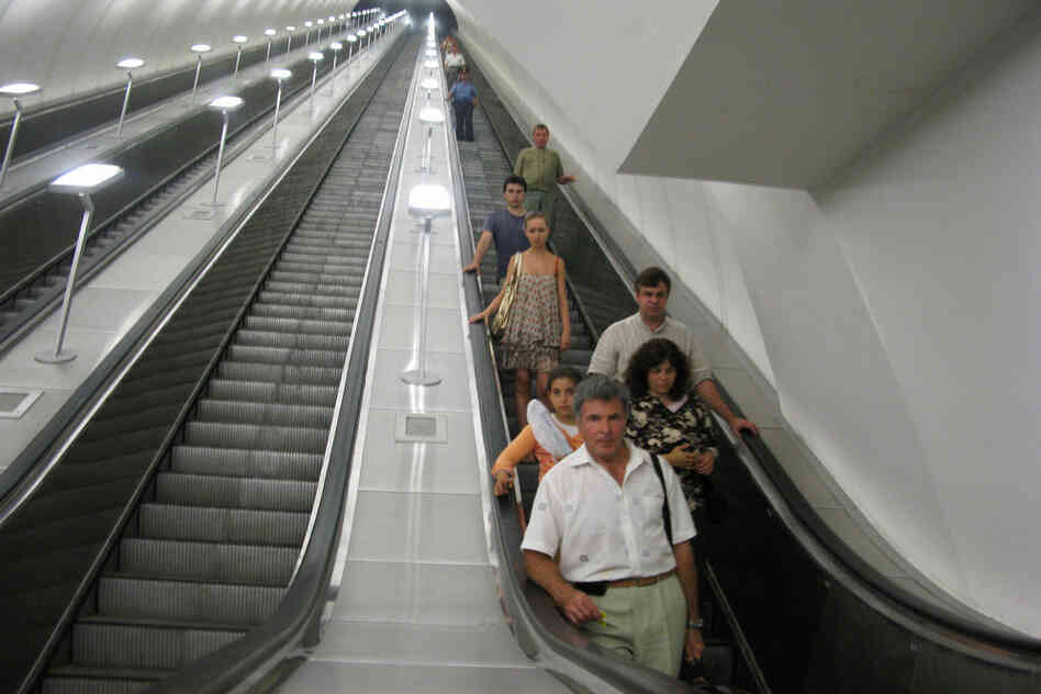 Riders descend a long escalator into the Dostoevskaya station, where the walls are mostly gray. The station has been in the works in Moscow for nearly 20 years, delayed by funding problems and perhaps concern over how it would be received.