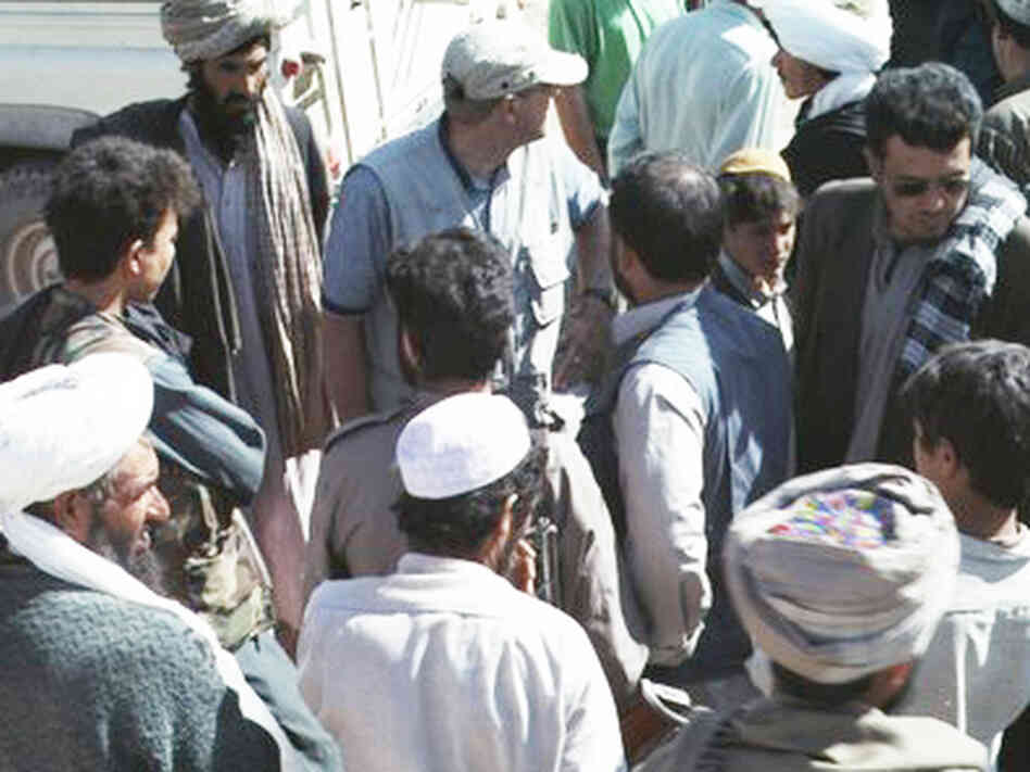 Tom Little, in blue shirt, in Afghanistan. Tom Little, in blue shirt, in Afghanistan.