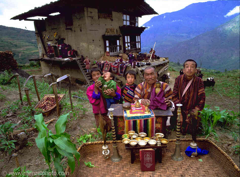 Nalim and Namgay are subsistence farmers who live with their family in a three-story, rammed-earth house in the 14-house village of Shingkhey, Bhutan. Nalim and her daughter care for the children and farm. Namgay, who has a hunched back and a clubfoot, grinds grain for neighbors with a small mill purchased from the government. He also reads sacred texts and conducts house cleansing and healing ...