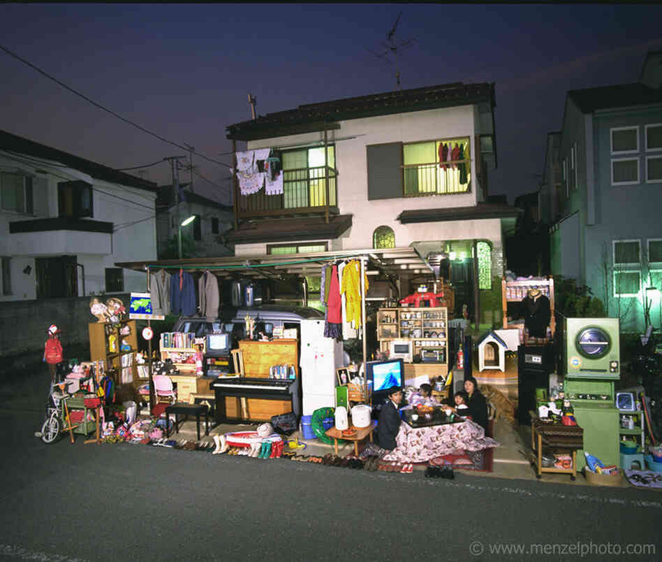 The Ukita family in front of their home in Tokyo. From Peter Menzel's "Material World" project, which photographs 30 statistically average families in 30 different countries with all of their possessions. 
